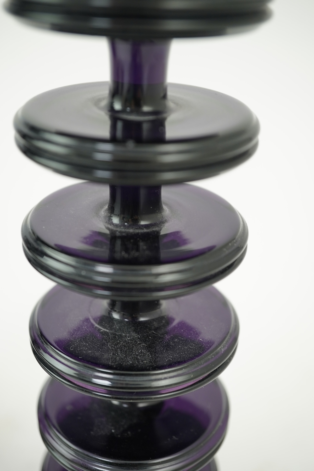 Ronald Stennett-Wilson (1915-2009) for Wedgwood: A pair of nine-ring 'Sheringham' amethyst glass candlesticks